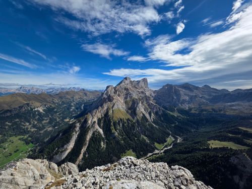 Free Breathtaking aerial view of the rugged peaks of the Dolomites under a clear blue sky. Stock Photo