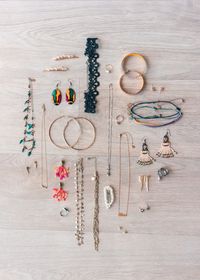 Handmade jewellery arranged in a flat lay, photo by Hana Brannigan on Pexels