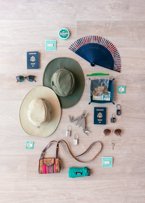 Flat Lay Of Hats And Accessories