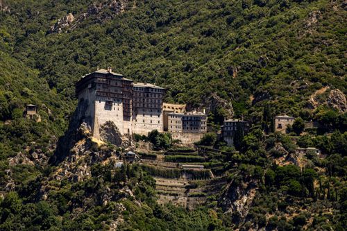 Free Scenic view of ancient monastery on Mount Athos surrounded by lush vegetation. Stock Photo