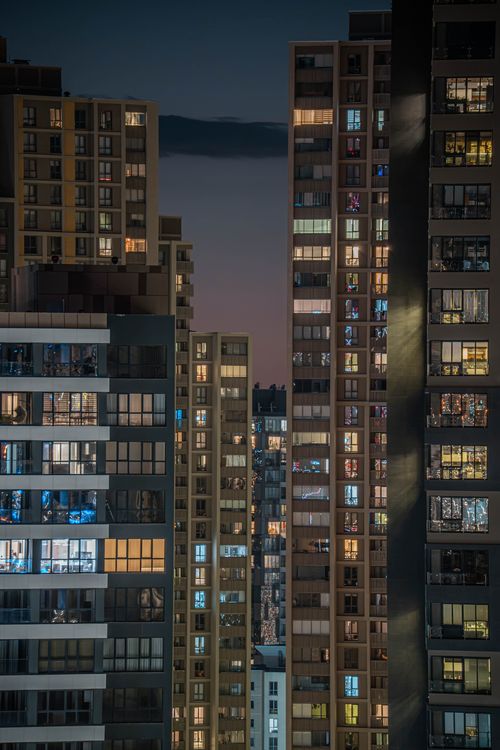 Free View of high-rise buildings illuminated at night in Ankara, Türkiye, capturing urban architecture. Stock Photo