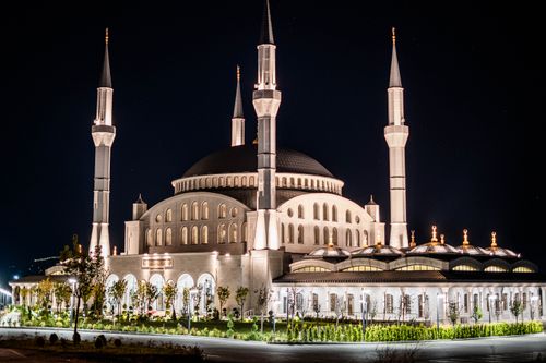 Free Glowing night shot of Kocatepe Mosque in Ankara, Türkiye, highlighting its stunning architecture. Stock Photo