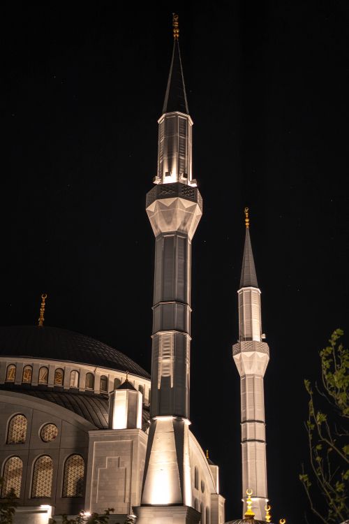 Free Beautifully illuminated Kocatepe Mosque minarets at night in Ankara, Türkiye. Stock Photo