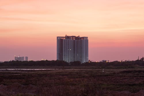 Kostnadsfri bild av byggnad, färgrik, solnedgång
