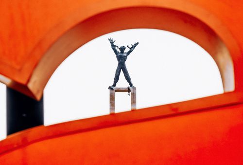 Free The Tugu Selamat Datang statue seen through a modern abstract sculpture in Jakarta, Indonesia. Stock Photo