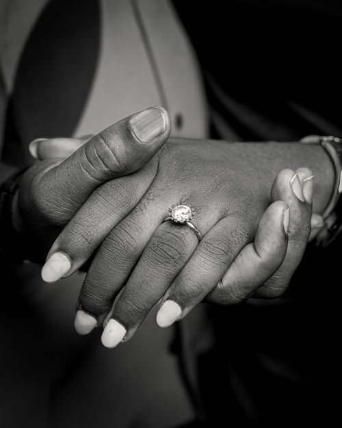 Free Black and white image of hands showcasing an elegant engagement ring, symbolizing love and commitment. Stock Photo