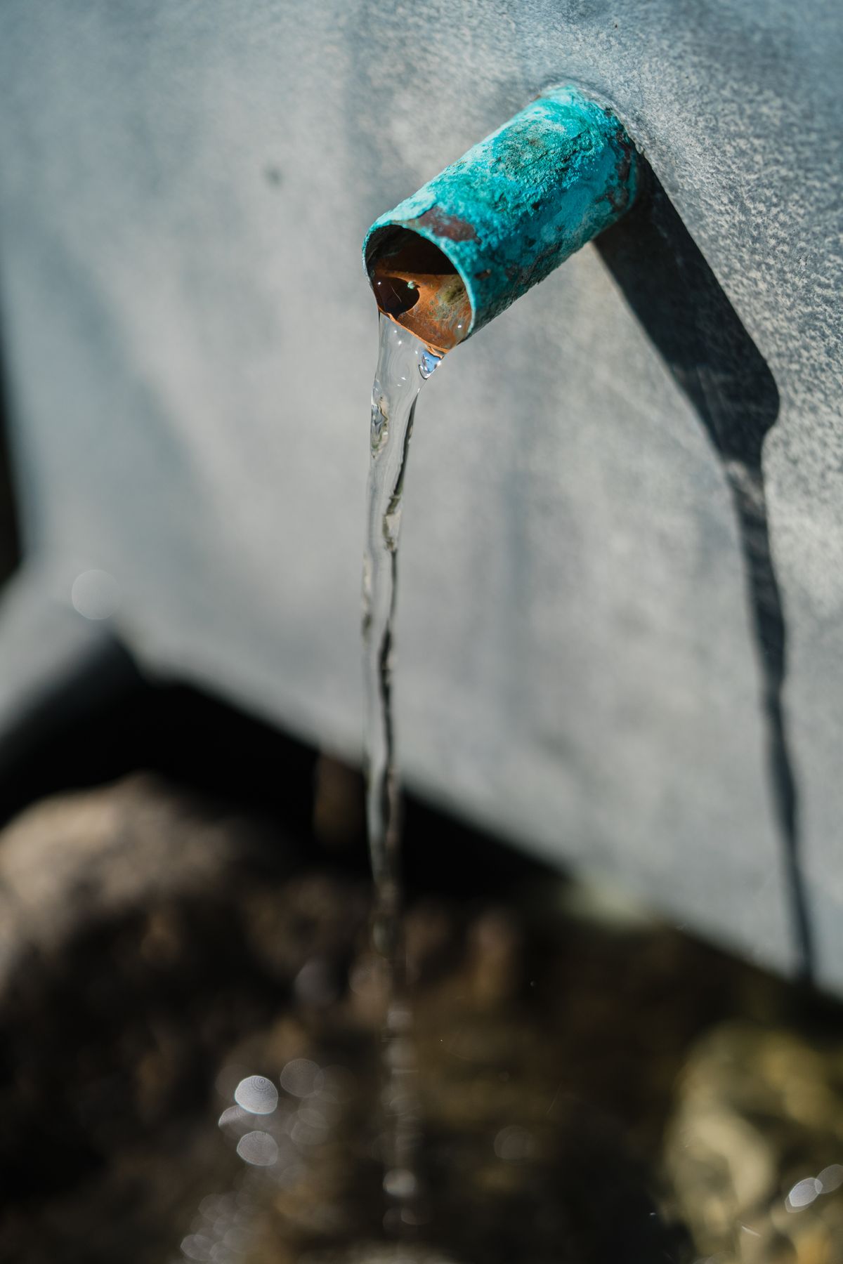 Water flowing from an oxidized outdoor pipe