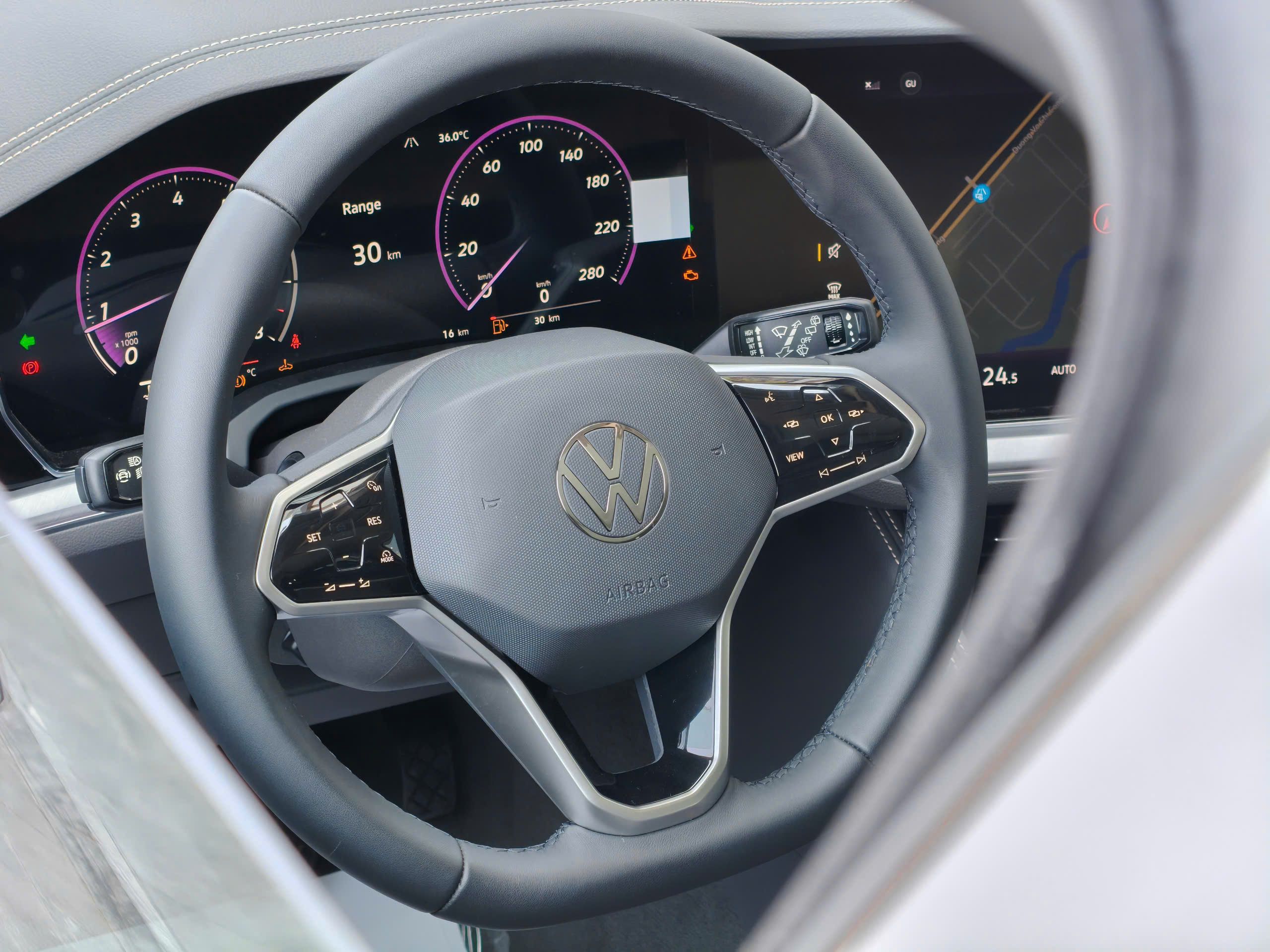Steering wheel and digital dashboard with speedometers and controls