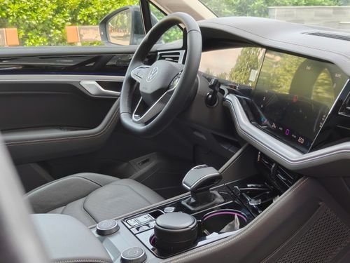 Free Luxurious car interior showcasing a sleek design and high-tech dashboard features. Stock Photo