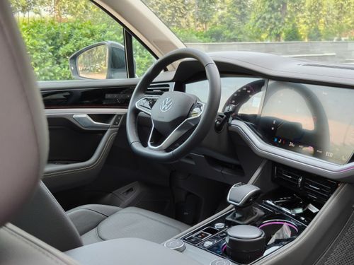 Free Sleek car interior showcasing a digital dashboard and steering wheel. Stock Photo