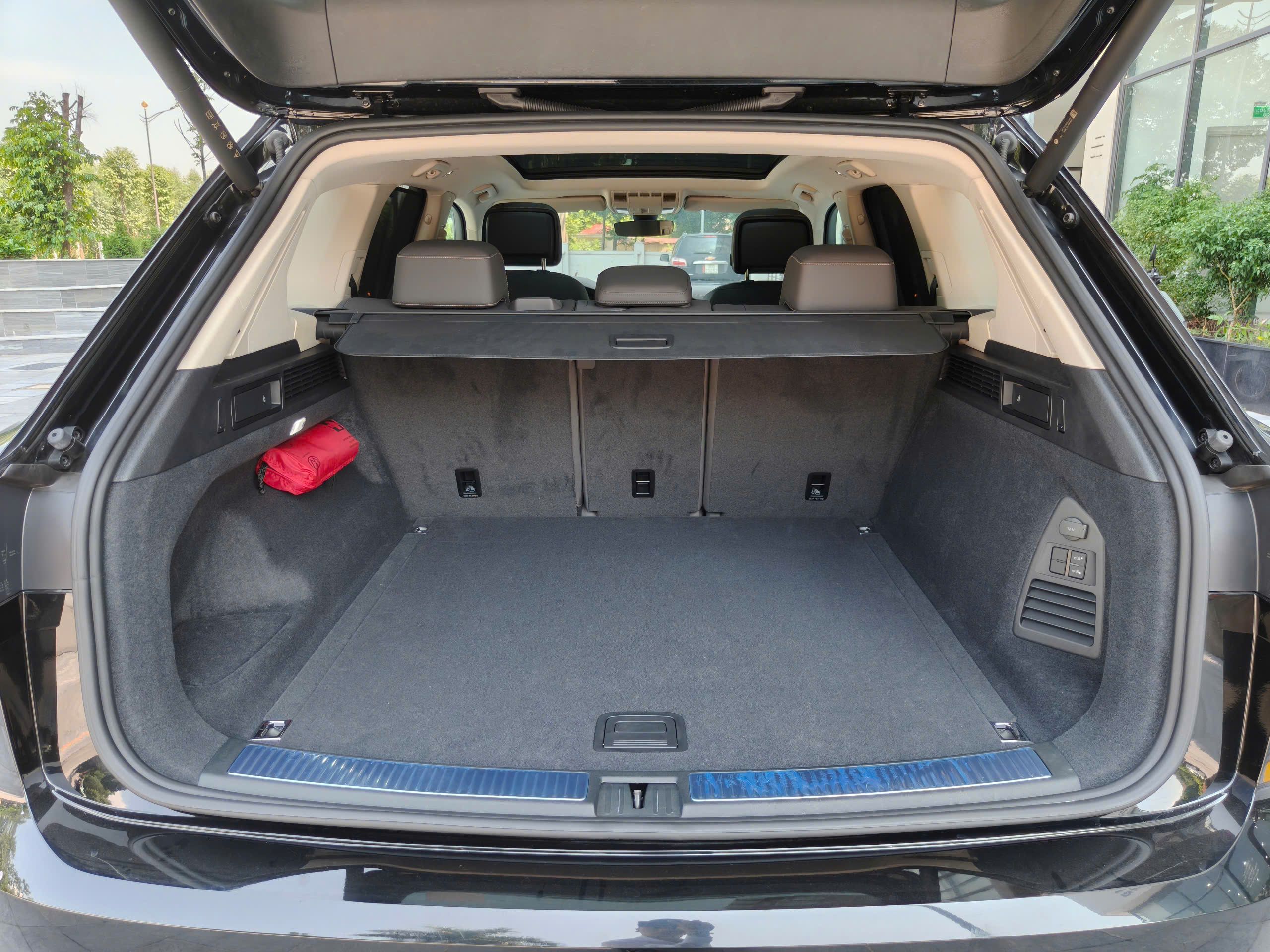 Open tailgate revealing a roomy SUV cargo compartment.