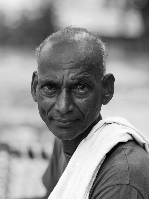 Free Thoughtful black and white portrait of a senior man outdoors. Stock Photo