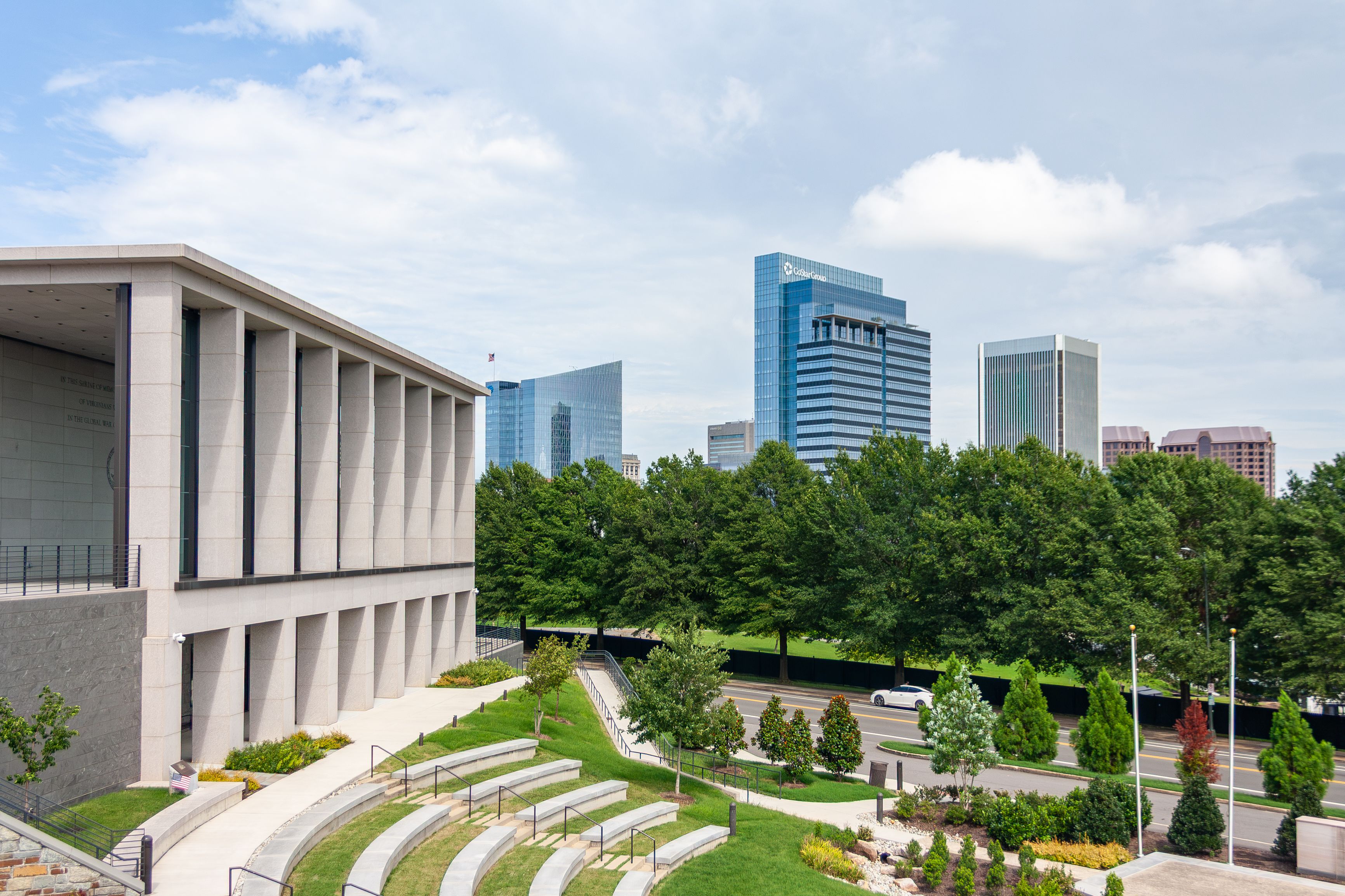 Richmond skyline featuring a modern architectural building with lush greenery and cityscape.