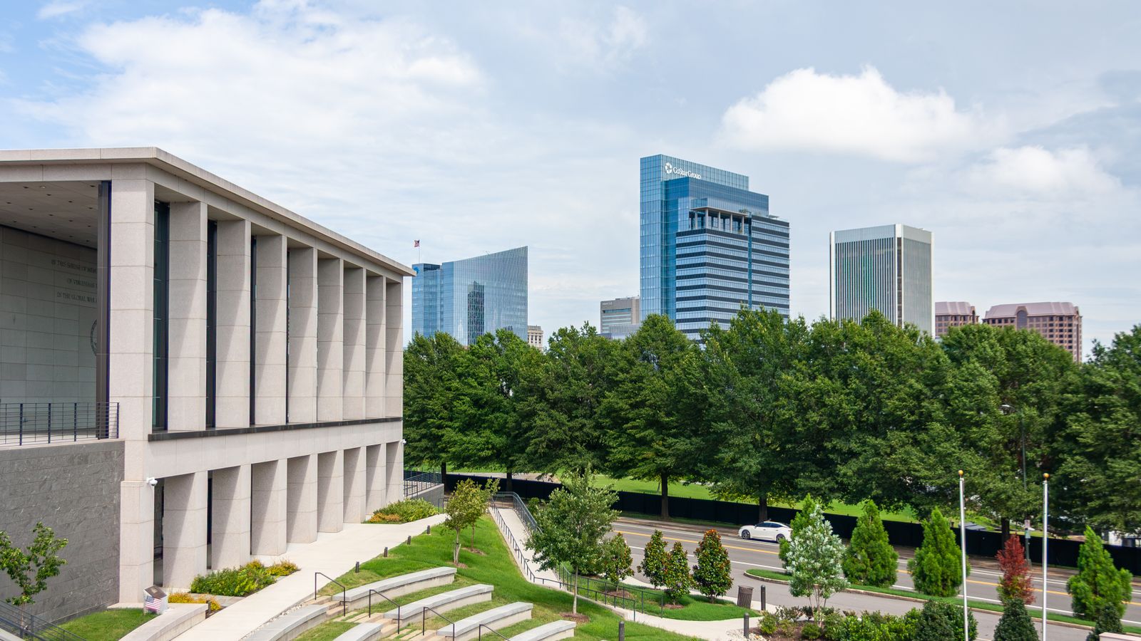 Richmond skyline featuring a modern architectural building with lush greenery and cityscape.