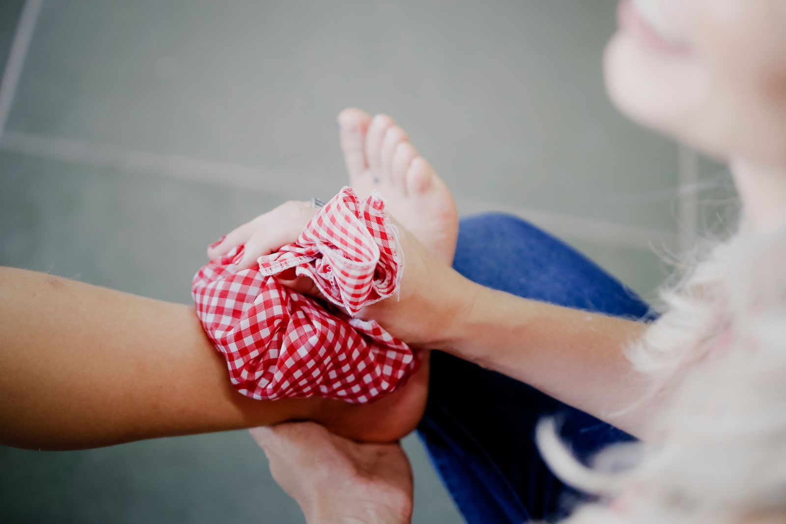 Lower legs and feet resting indoors, matching compression sock selection for restless-leg discomfort. Photo: Pexels.
