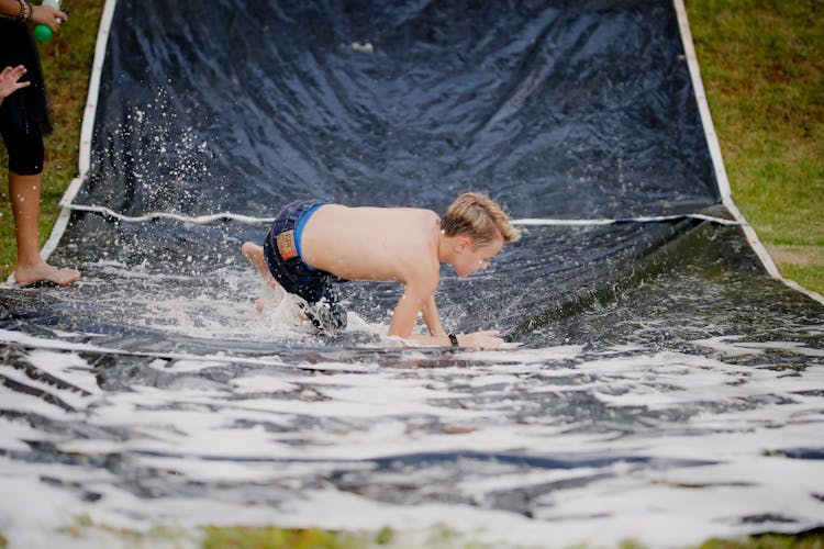 Boy On A Slip And Slide