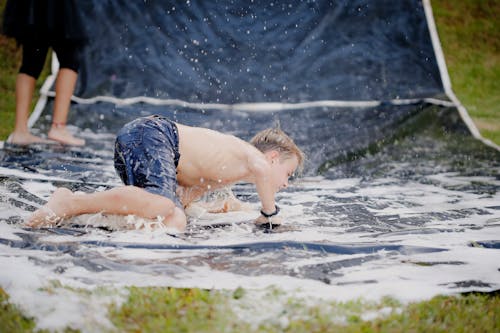 Boy On A Slip And Slide