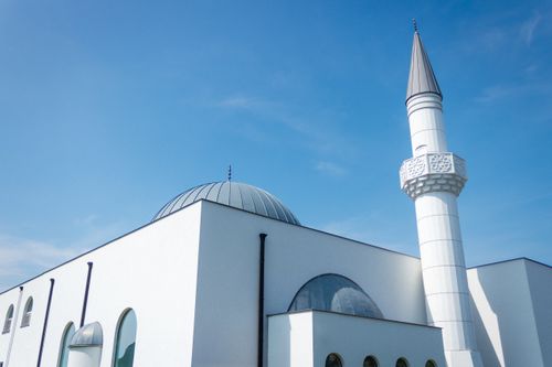 Free Stunning modern mosque architecture with a dome and minaret under a clear blue sky in Genk, Belgium. Stock Photo