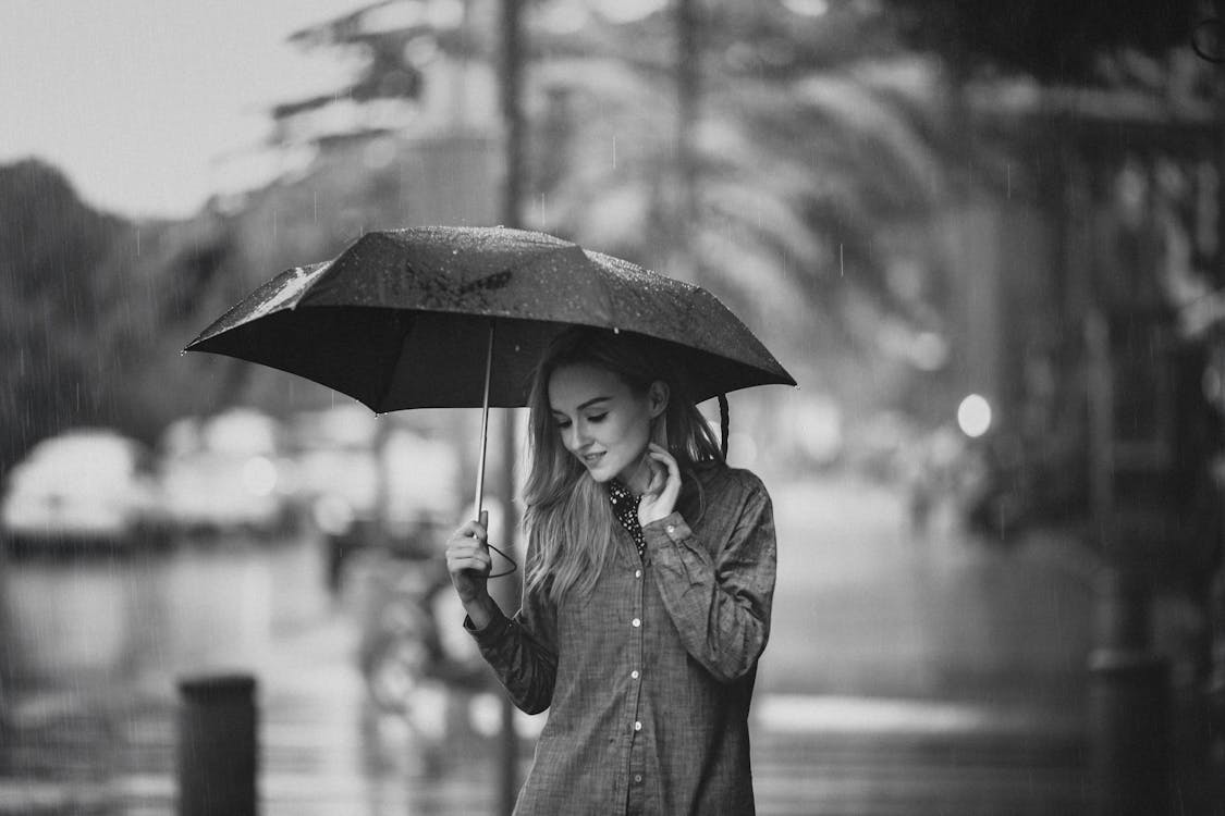 Free Woman Holding An Umbrella Stock Photo