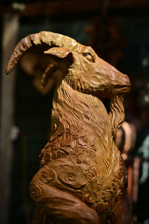 Free Detailed close-up of an artistic wooden goat sculpture showcasing craftsmanship. Stock Photo