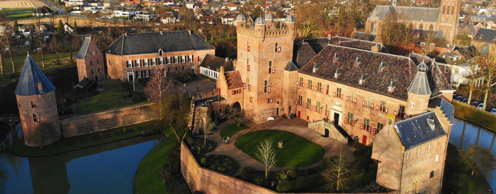 Drone shot of Huis Bergh Castle, surrounded by a moat in 's-Heerenberg, Gelderland, Netherlands.