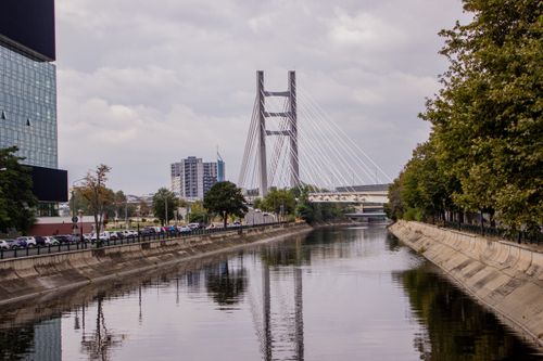 Free A scenic view of a cable-stayed bridge over a canal in Bucharest, Romania. Stock Photo