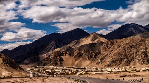 Free Dramatic landscape of Nyoma village in Ladakh with rugged mountains under a cloudy sky. Stock Photo