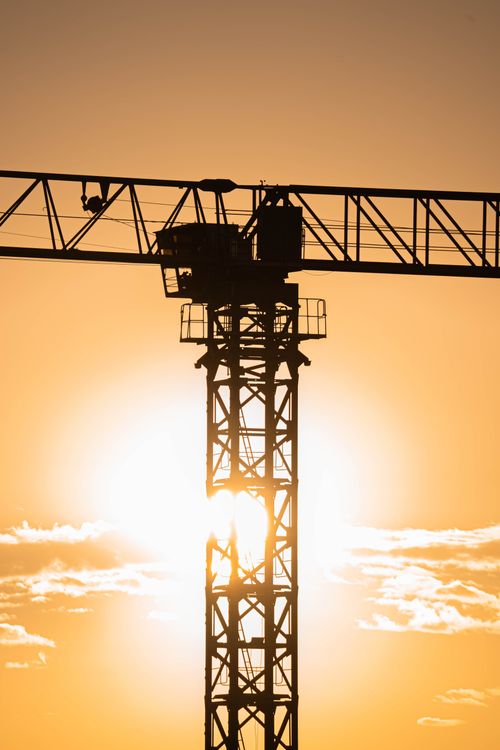 Free A silhouette of a crane against a vibrant sunset sky in Gölbaşı, Ankara, Türkiye. Stock Photo
