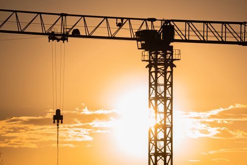 Free A construction crane silhouetted against the sunset sky in Gölbaşı, Ankara, Türkiye. Stock Photo