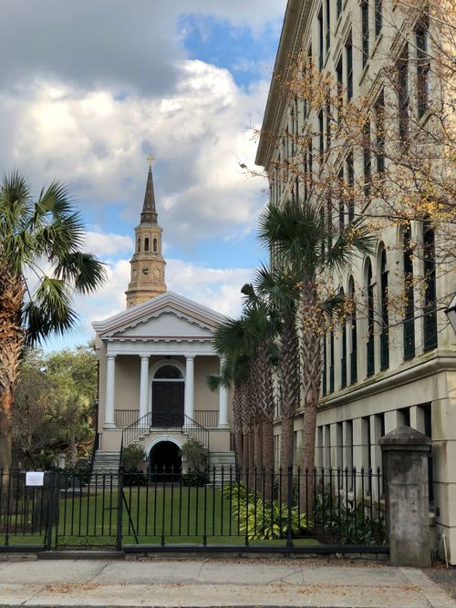 Free Classic church architecture and palm trees in historic Charleston, SC. Stock Photo
