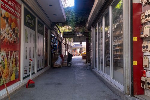 Free Quiet alley in Izmir market, showcasing local shops and traditional goods. Stock Photo