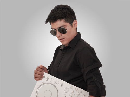Free Confident young DJ in black attire holding a turntable against a plain white background. Stock Photo