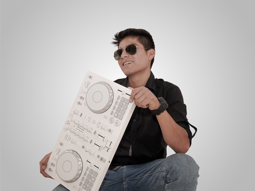 Free A young man with sunglasses holding a white DJ mixing console against a plain background. Stock Photo
