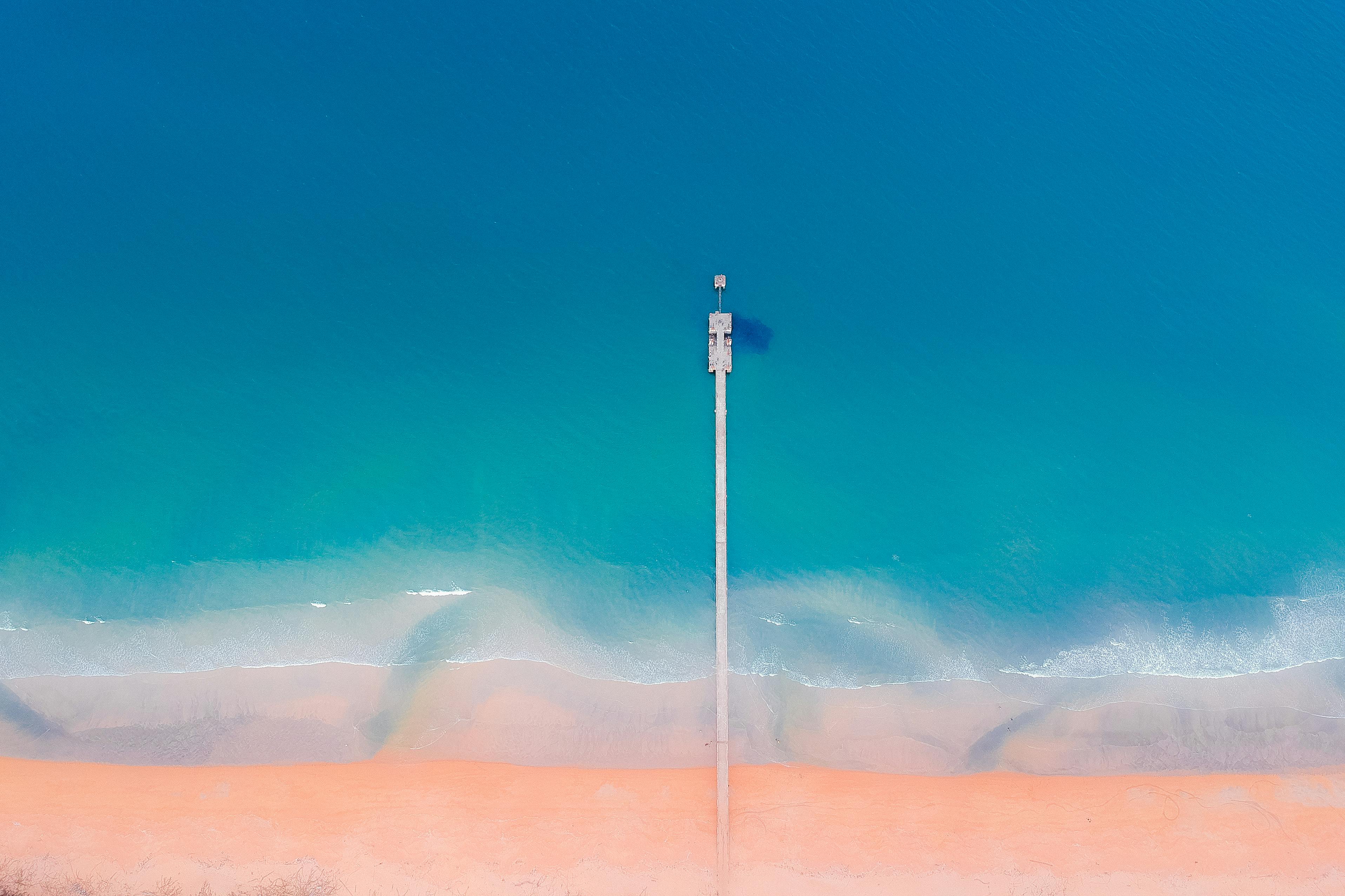 long dock under blue sky