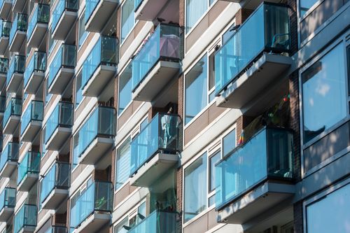 Free Close-up view of a modern apartment facade with glass balconies in Delft, Netherlands. Stock Photo