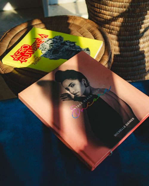 Free Two books on a wicker table, captured in warm, soft light, exploring design and culture themes. Stock Photo