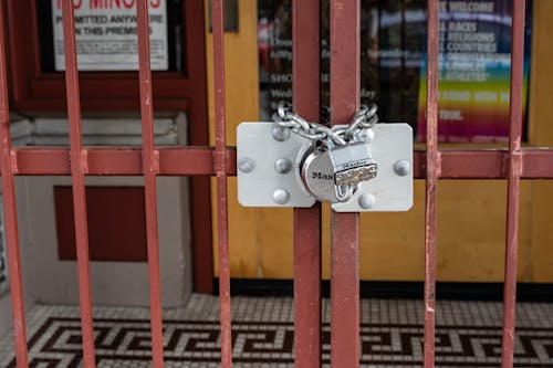 Red Metal Gate With Padlock