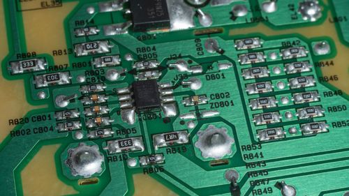 Free Detailed view of electronic circuit board components and soldered connections. Stock Photo