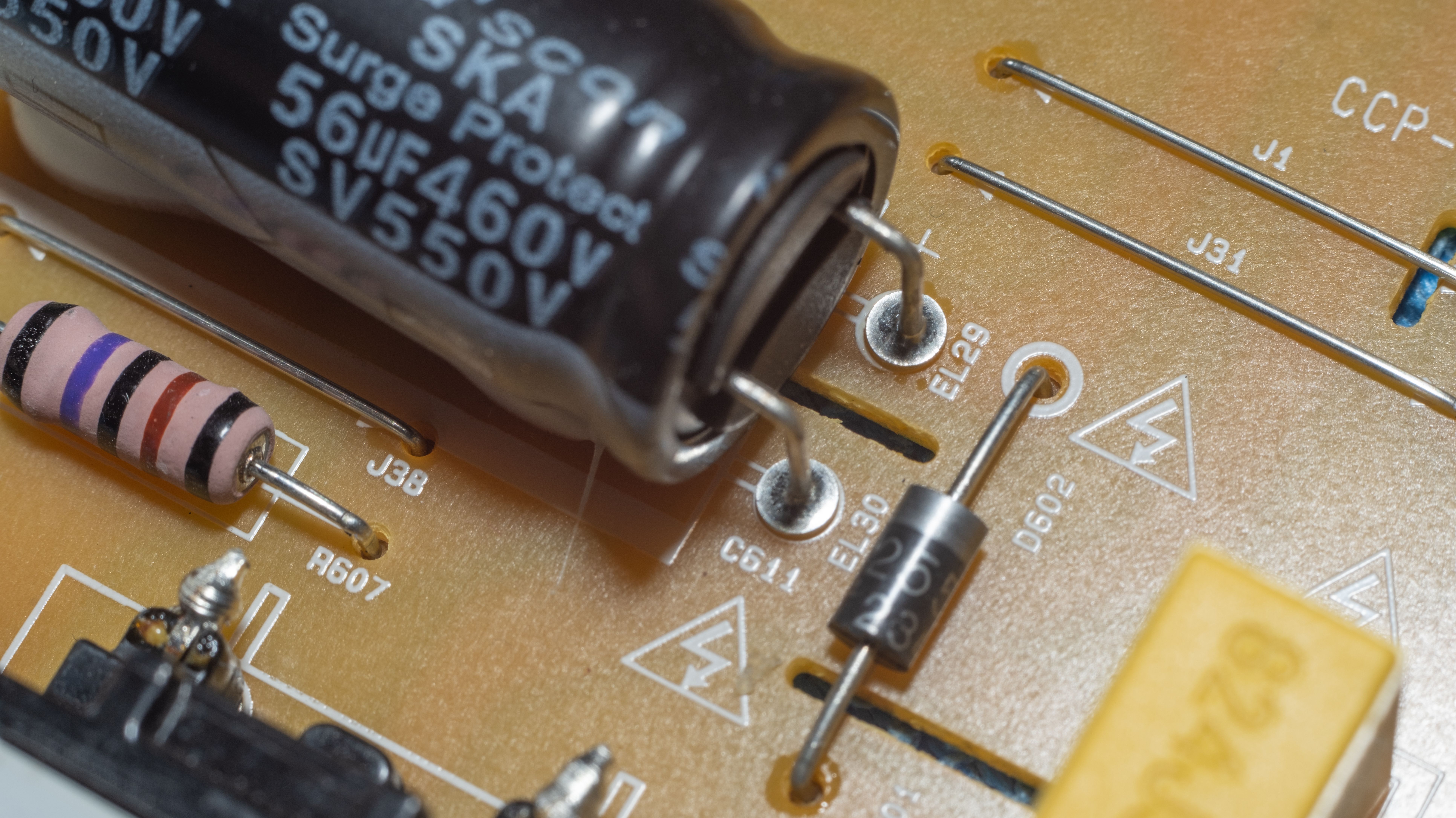 Detailed shot of PCB with capacitor, resistor, diodes, and circuit traces.