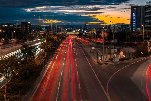 Free Captivating image of Ankara's bustling city traffic with vibrant light trails under a twilight sky. Stock Photo