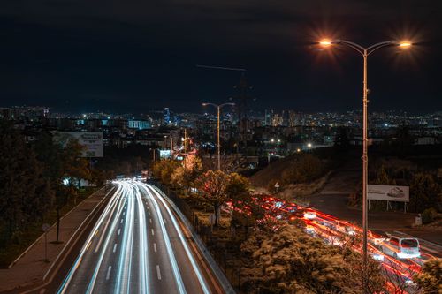 Free Long exposure shot of Ankara's bustling nighttime traffic with city lights illuminating the urban skyline. Stock Photo