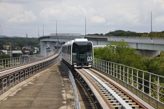 High-speed Linimo maglev train traveling on elevated tracks in Nagakute, Aichi, Japan.