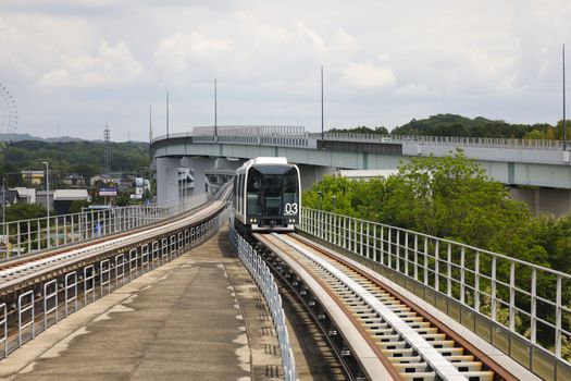 Maglev train on elevated track in Nagakute, Aichi, Japan showcasing innovative transportation.