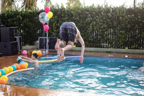 Man Jumping Into The Pool