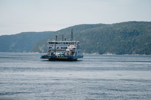 Free A ferry cruising the scenic Saguenay River in Tadoussac, Québec, Canada. Stock Photo