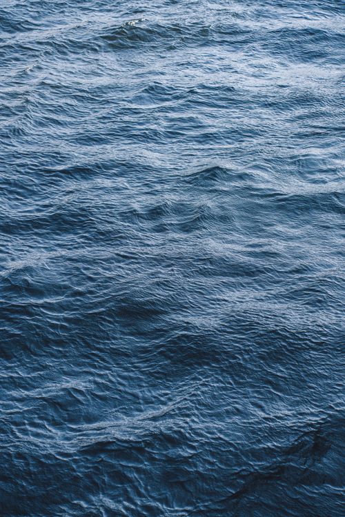 Free Tranquil ocean waves captured off Tadoussac, a peaceful maritime scene. Stock Photo