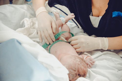 Free Measuring Newborn Baby Stock Photo