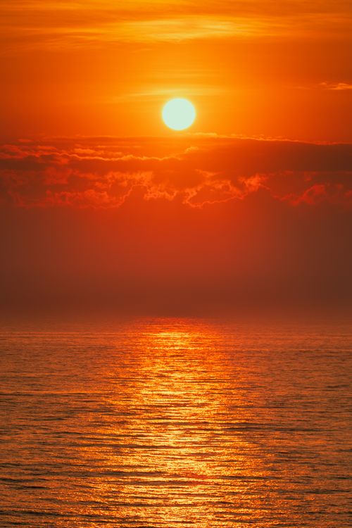 Free Breathtaking sunset view over the calm waters of Cửa Tùng Beach, Quảng Trị, Vietnam. Stock Photo