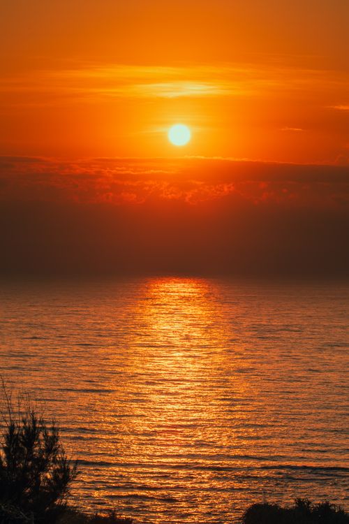 Free Captivating sunset view over Cửa Tùng beach, Vietnam, with vibrant colors reflecting on the sea. Stock Photo