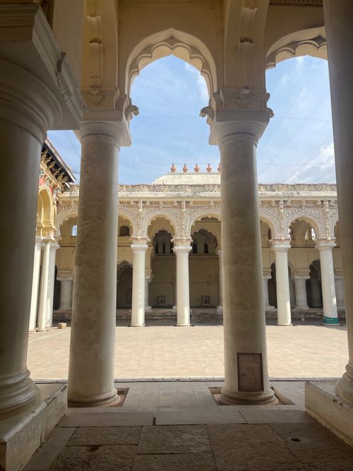 Free Explore the grandeur of historical arched architecture through this stunning courtyard view. Stock Photo